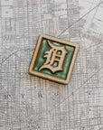 4x4 Old English D tile in Ivy/Natural on a Detroit Map.