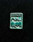 This magnet features the matte turquoise Pewabic Blue glaze.
