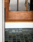Detailed shot of 3x3 tiles in blue and green surrounded by 3x4 border tiles in grey and blue.