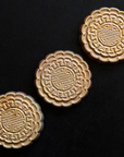 Three Mooncake Paperweights in shimmering Blush Iridescent.  