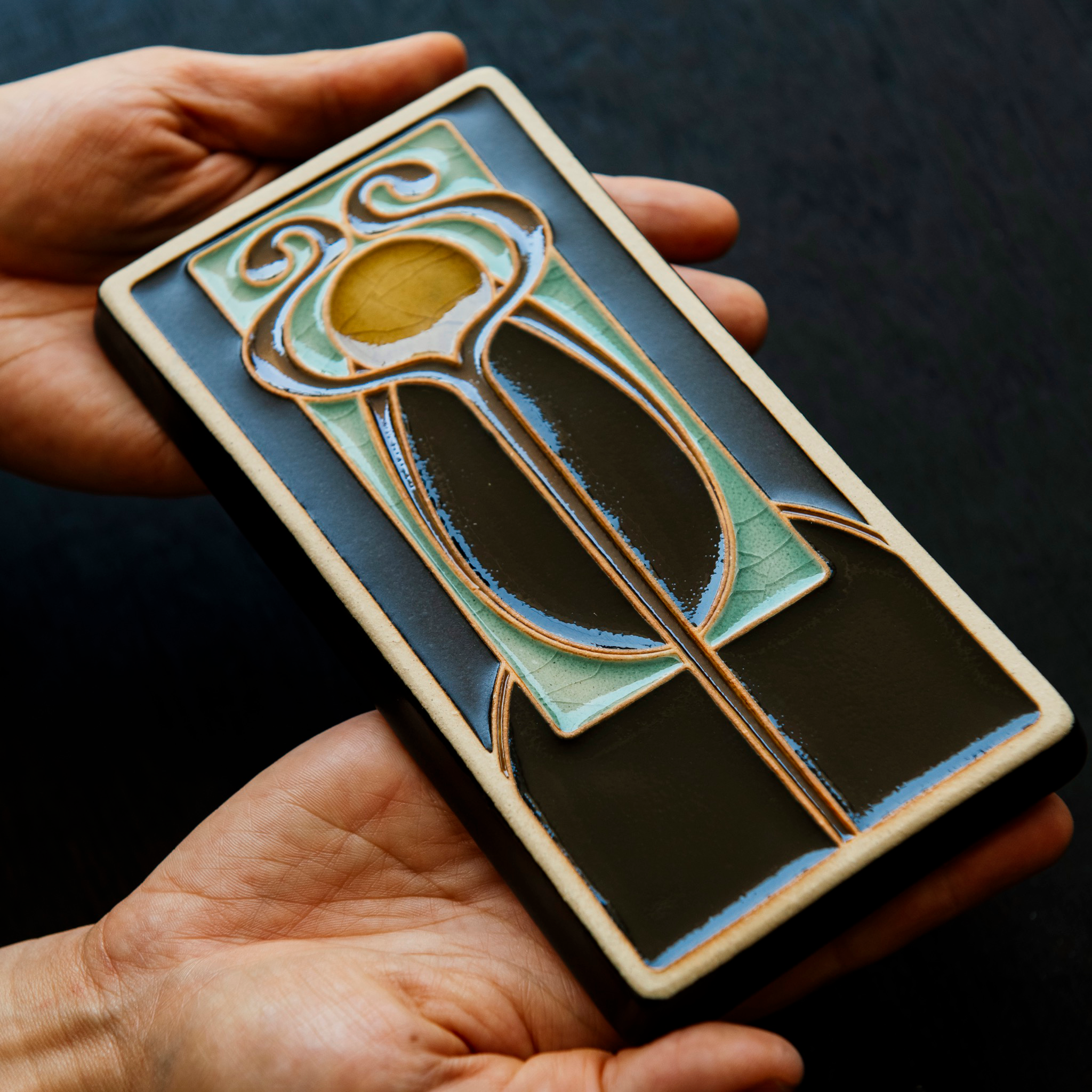 A Hand-Painted Stickley Tile in our glossy, multi-colored "Obsidian" palette. 
