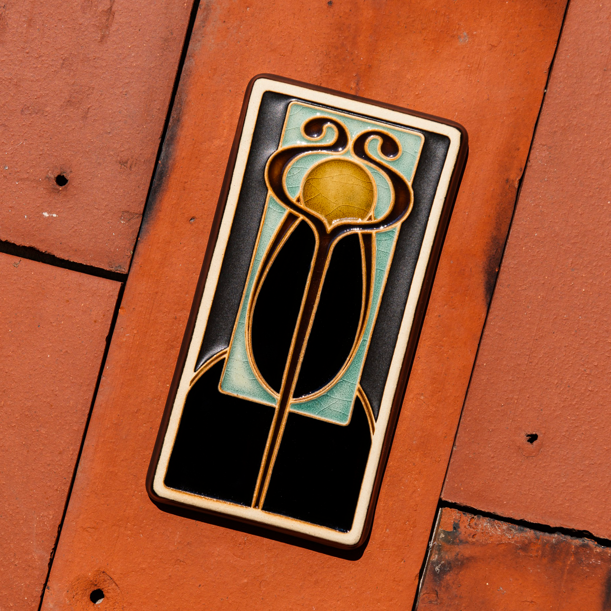 A Hand-Painted Stickley Tile in our glossy, multi-colored "Obsidian" palette. 