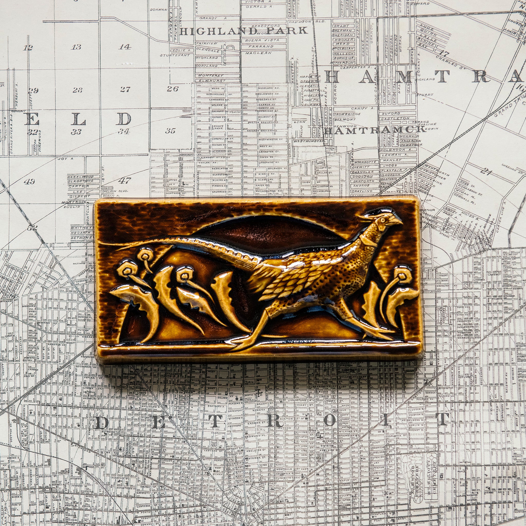 This tile features the glossy earthy brown Molasses glaze.