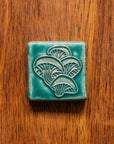 This tile features the matte turquoise Pewabic Blue glaze.