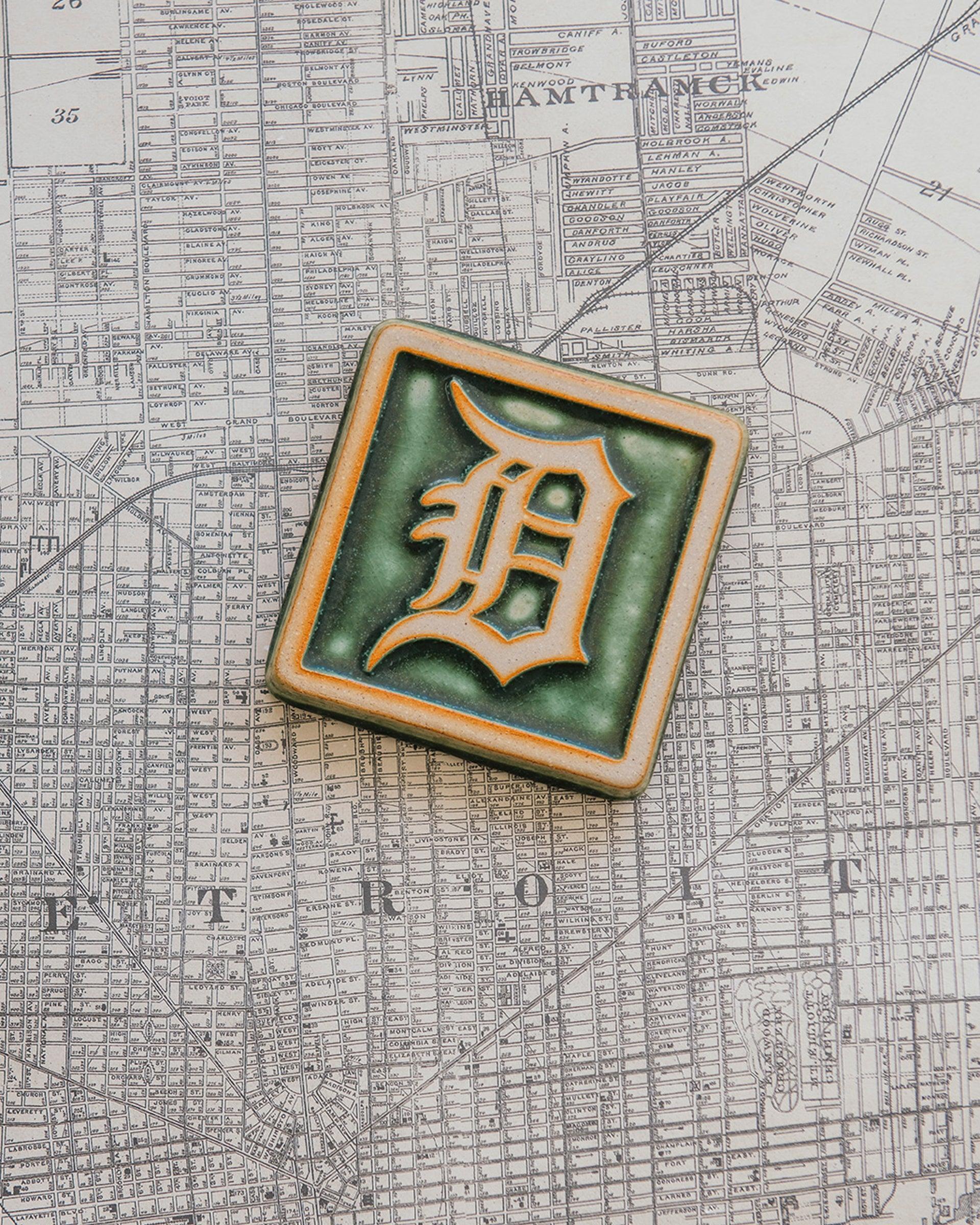 4x4 Old English D tile in Ivy/Natural on a Detroit Map.