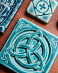 This tile features the matte turquoise Pewabic Blue glaze.