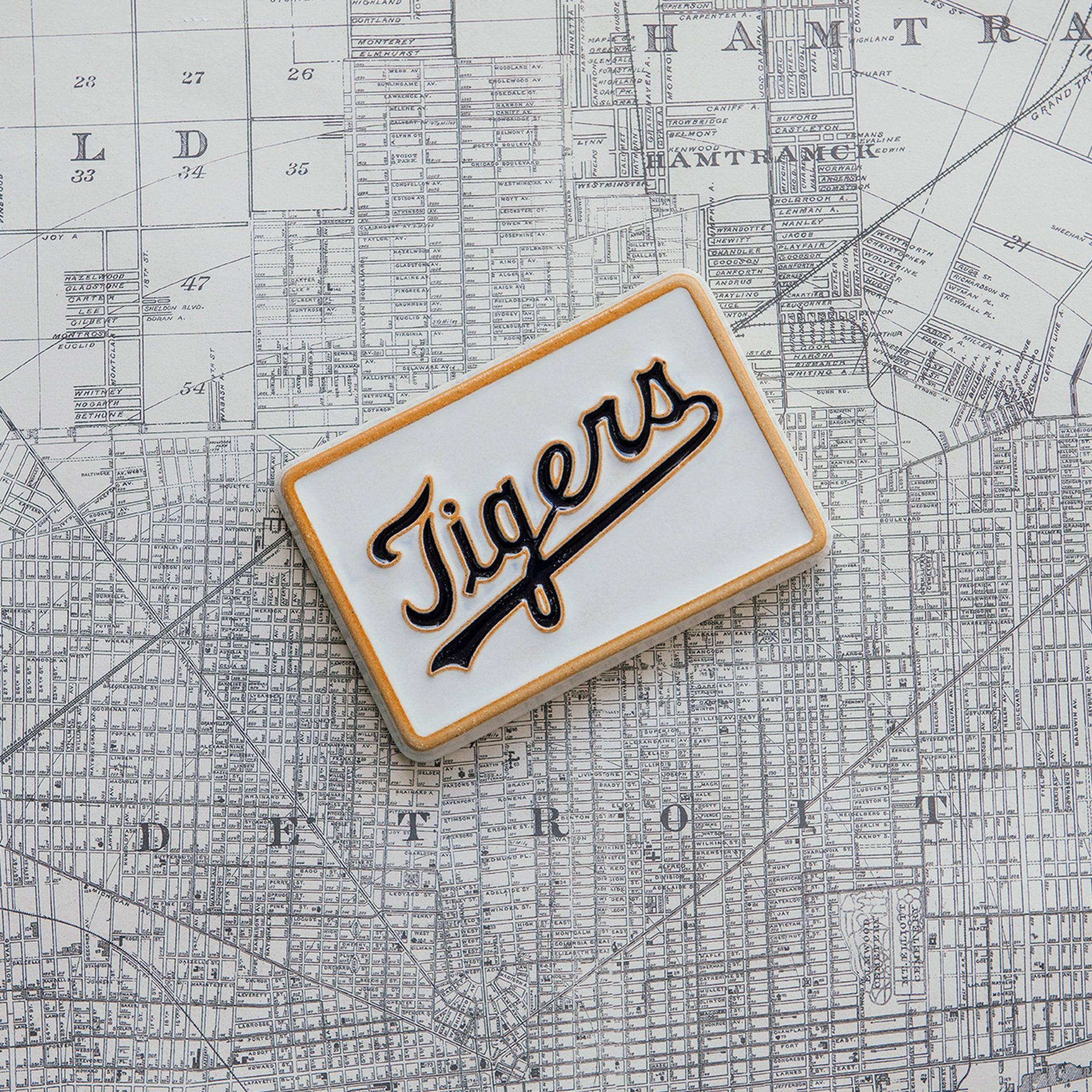 Tigers 4x6 tile resting on a map of the city of Detroit. 