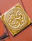 This Honey Phoenix rests on terracotta roof tiles.