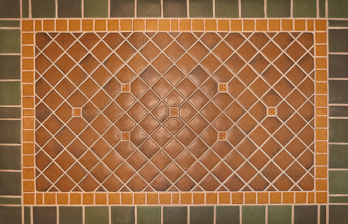 Bayleaf glazed tiles make up the trim of this foyer detail shot with a warm, chestnut glazed center. 